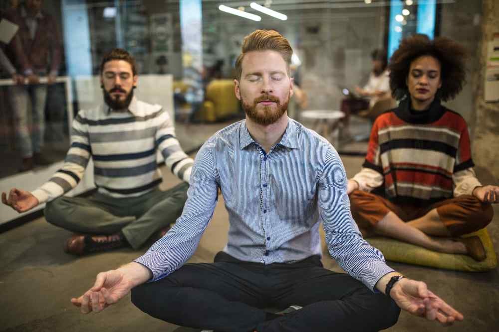 Newtown Therapy | Group of people meditating